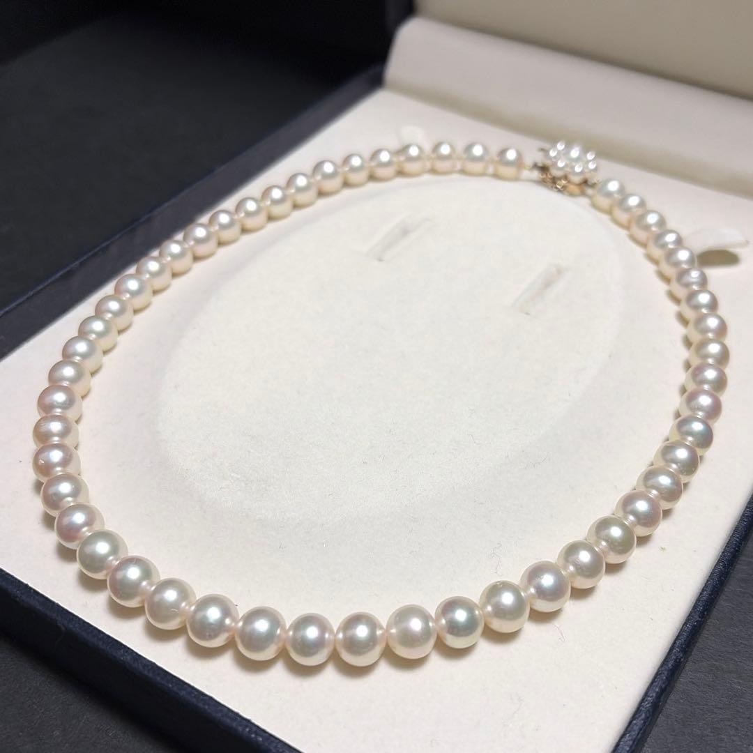 Tasaki Akoya pearl necklace with 8.0-8.5mm pearls and K14 clasp on a white background