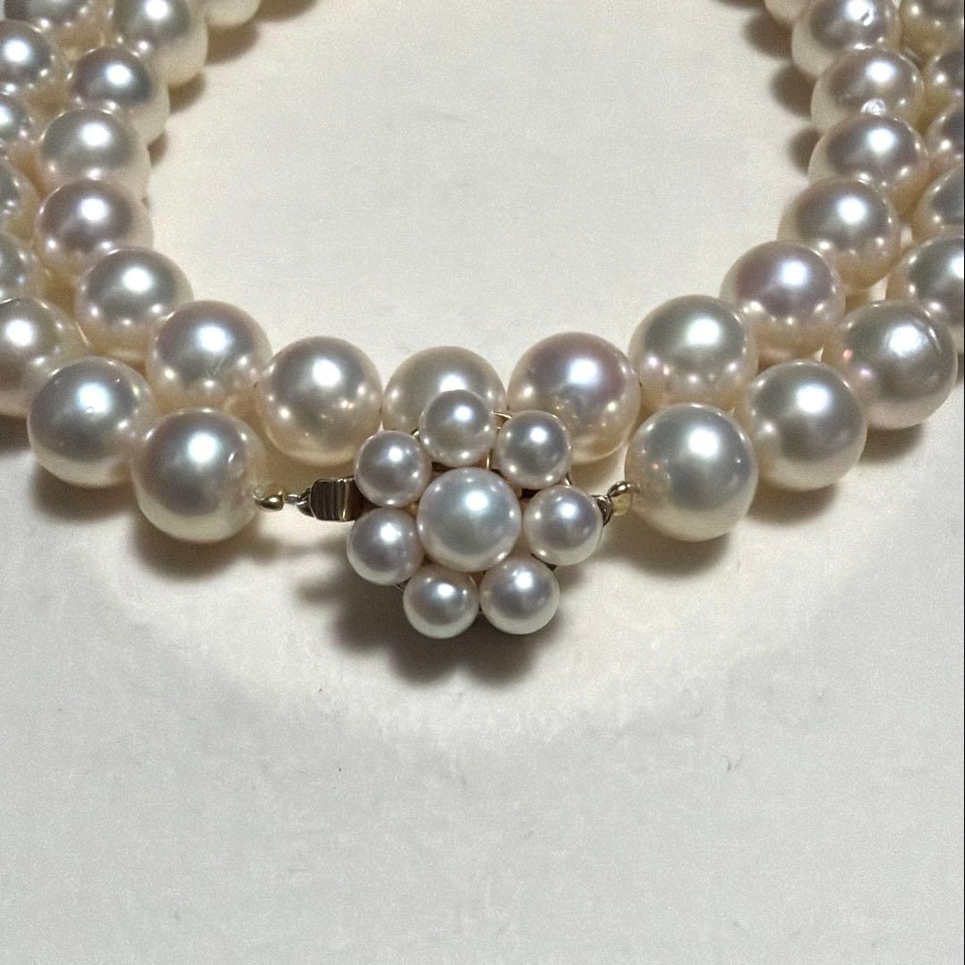 Tasaki Akoya pearl necklace with 8.0-8.5mm pearls and K14 clasp on a white background