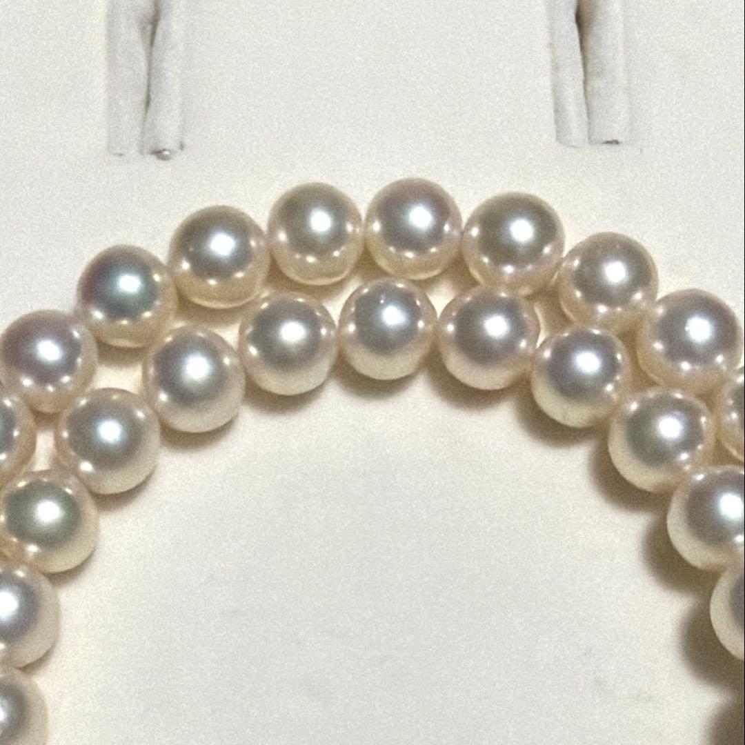 Tasaki Akoya pearl necklace with 8.0-8.5mm pearls and K14 clasp on a white background