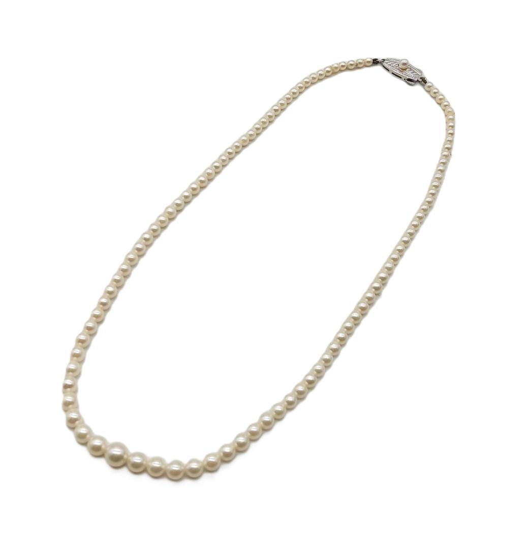 Mikimoto Akoya pearl gradient necklace with pearls ranging 3 to 7 mm displayed with velour case