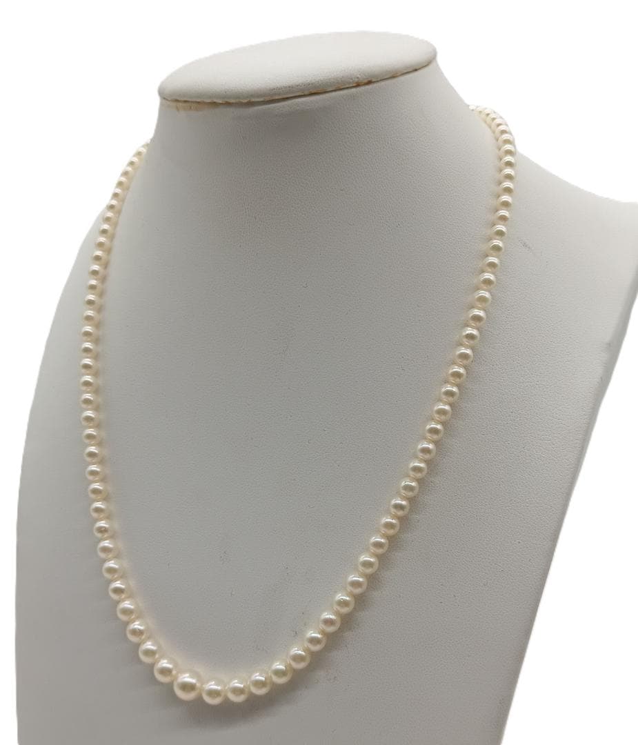 Mikimoto Akoya pearl gradient necklace with pearls ranging 3 to 7 mm displayed with velour case