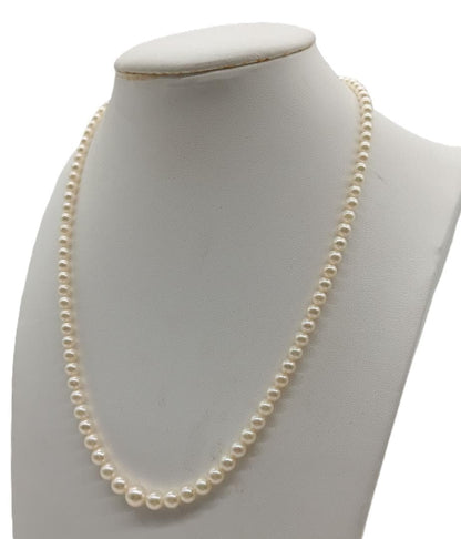 Mikimoto Akoya pearl gradient necklace with pearls ranging 3 to 7 mm displayed with velour case