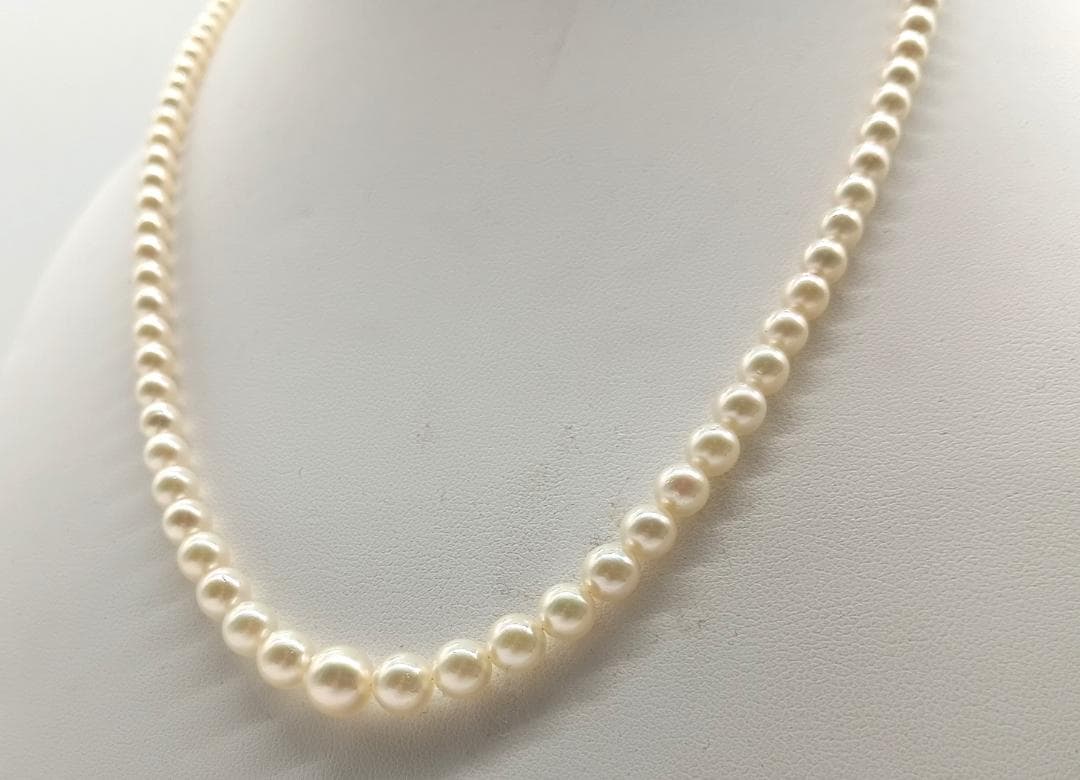 Mikimoto Akoya pearl gradient necklace with pearls ranging 3 to 7 mm displayed with velour case