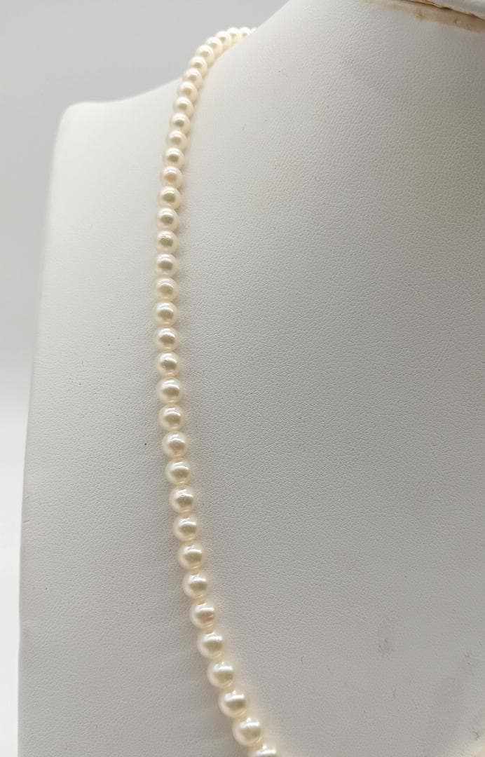 Mikimoto Akoya pearl gradient necklace with pearls ranging 3 to 7 mm displayed with velour case