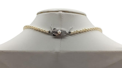 Mikimoto Akoya pearl gradient necklace with pearls ranging 3 to 7 mm displayed with velour case