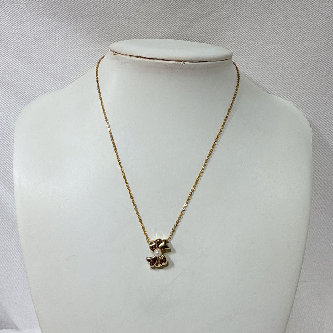 Mikimoto Gold Color Akoya Pearl Pendant with silver pendant and 16-inch chain on white background