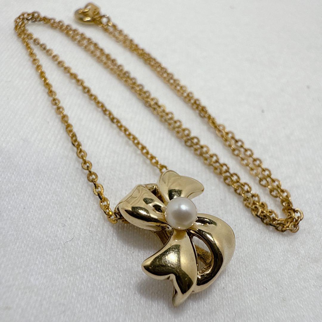 Mikimoto Gold Color Akoya Pearl Pendant with silver pendant and 16-inch chain on white background