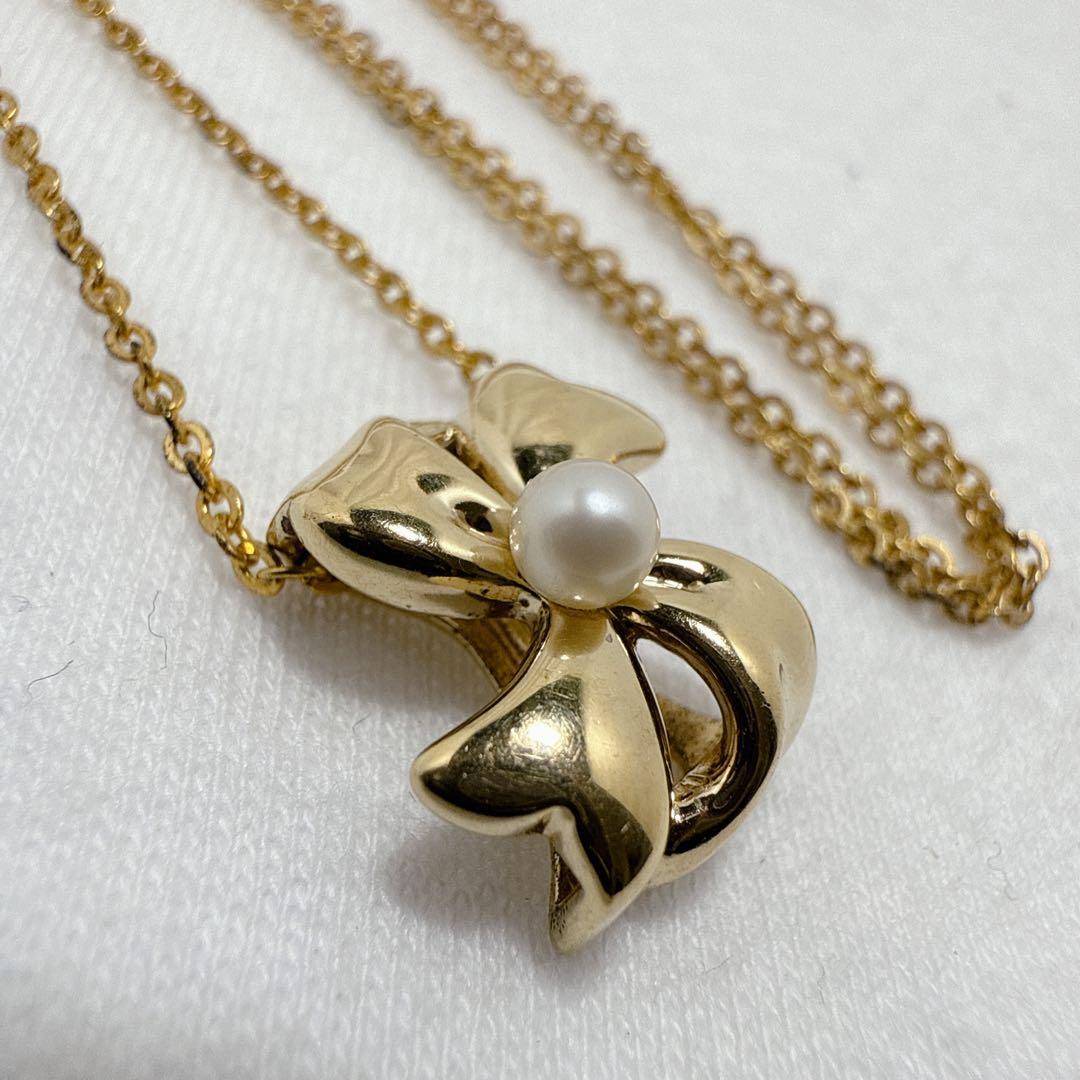 Mikimoto Gold Color Akoya Pearl Pendant with silver pendant and 16-inch chain on white background