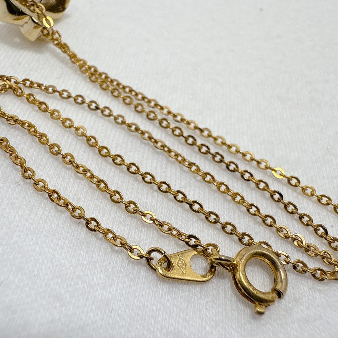 Mikimoto Gold Color Akoya Pearl Pendant with silver pendant and 16-inch chain on white background