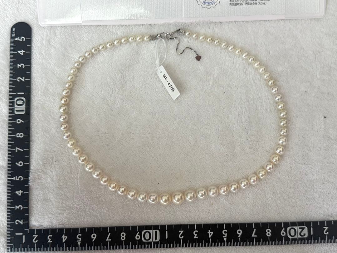 Multi-colored Akoya pearl gradient necklace 4.7-9mm on white background with certificate