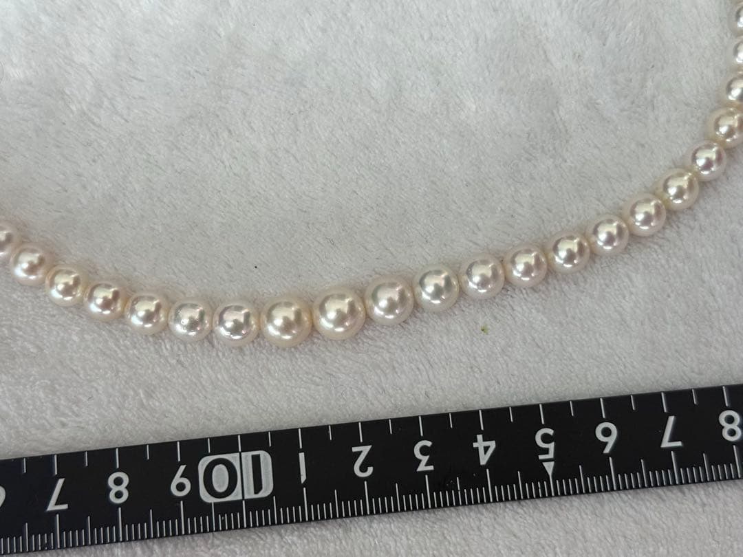 Multi-colored Akoya pearl gradient necklace 4.7-9mm on white background with certificate