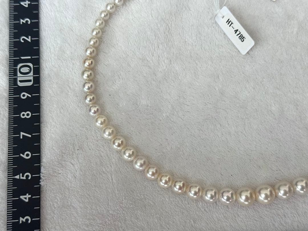 Multi-colored Akoya pearl gradient necklace 4.7-9mm on white background with certificate