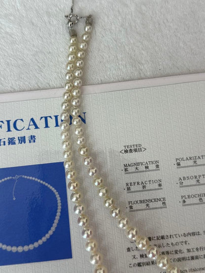 Multi-colored Akoya pearl gradient necklace 4.7-9mm on white background with certificate