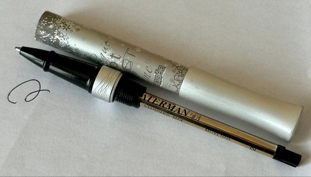 Waterman Odoce Shine Pearl silver ballpoint pen with small scratches on the cap, shown uncapped on a white background