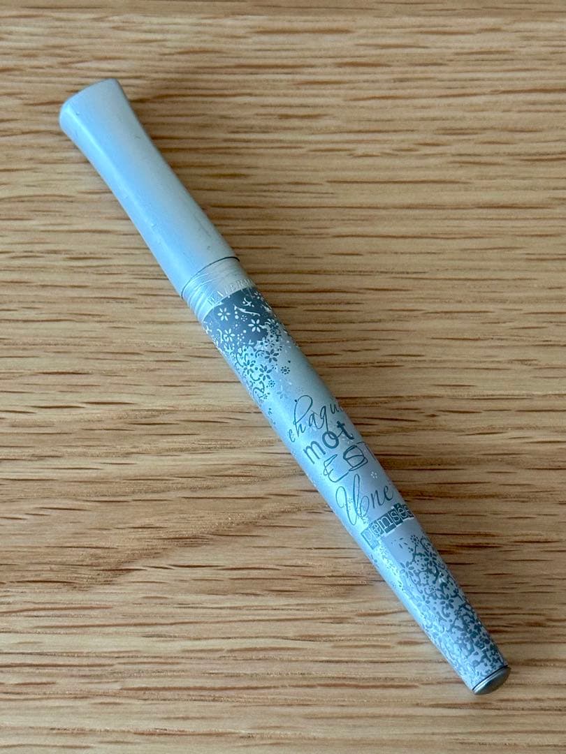 Waterman Odoce Shine Pearl silver ballpoint pen with small scratches on the cap, shown uncapped on a white background