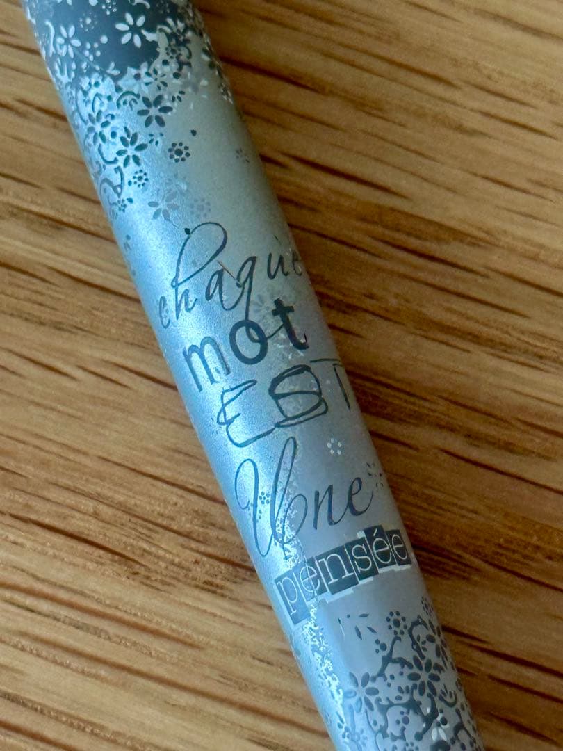 Waterman Odoce Shine Pearl silver ballpoint pen with small scratches on the cap, shown uncapped on a white background