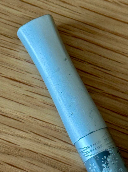 Waterman Odoce Shine Pearl silver ballpoint pen with small scratches on the cap, shown uncapped on a white background