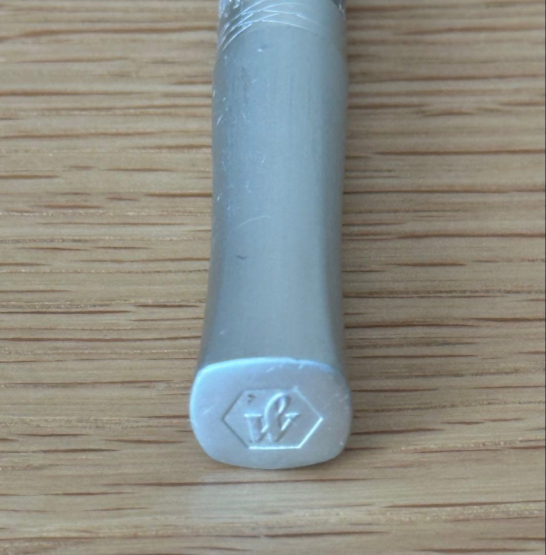 Waterman Odoce Shine Pearl silver ballpoint pen with small scratches on the cap, shown uncapped on a white background