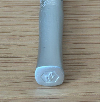 Waterman Odoce Shine Pearl silver ballpoint pen with small scratches on the cap, shown uncapped on a white background