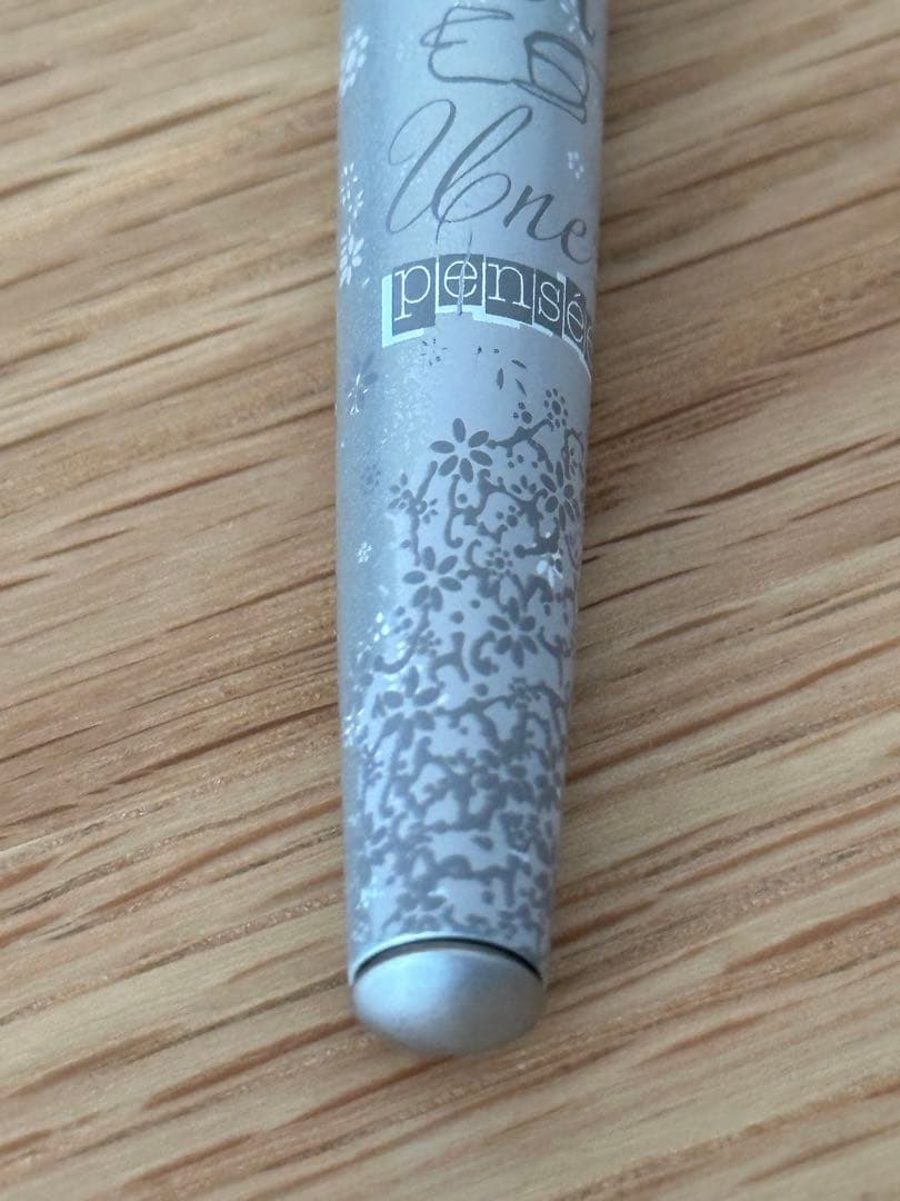 Waterman Odoce Shine Pearl silver ballpoint pen with small scratches on the cap, shown uncapped on a white background