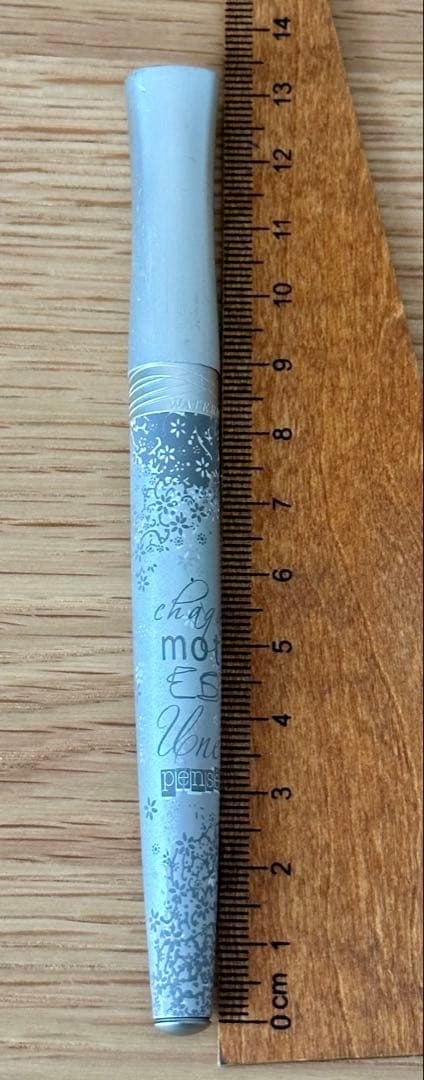 Waterman Odoce Shine Pearl silver ballpoint pen with small scratches on the cap, shown uncapped on a white background