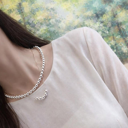 K18YG yellow gold necklace with 6-7mm Akoya pearls and Y-shaped 2Way Chopin chain on white background