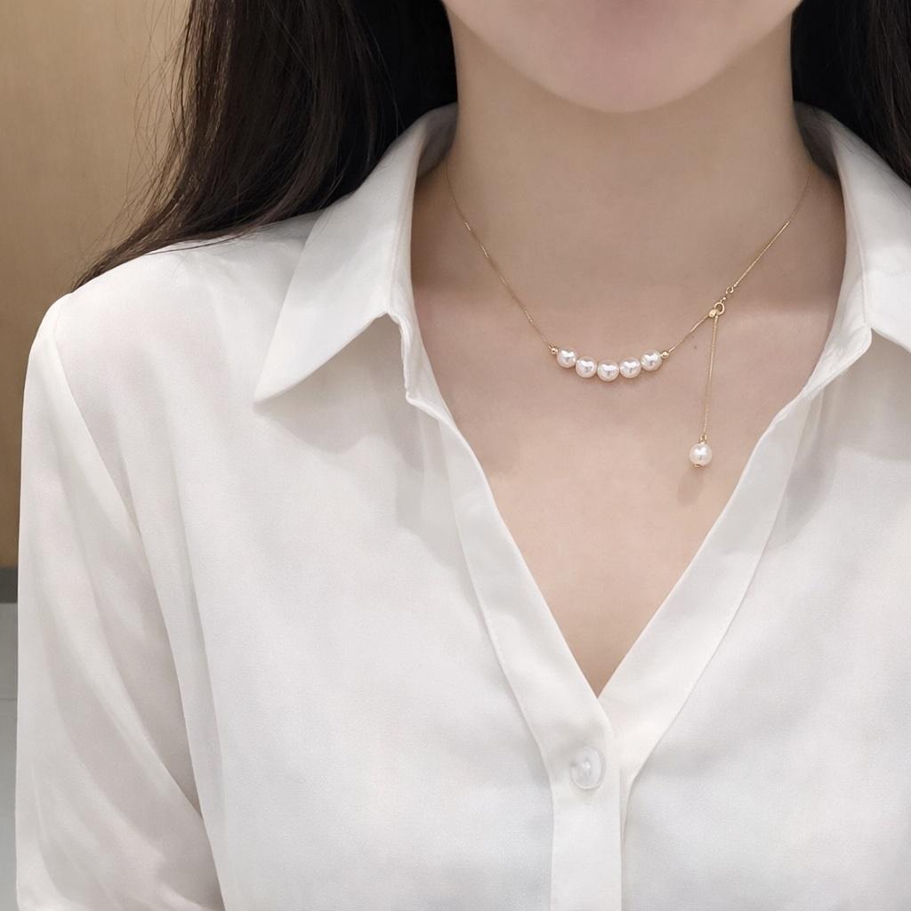 K18YG yellow gold necklace with 6-7mm Akoya pearls and Y-shaped 2Way Chopin chain on white background