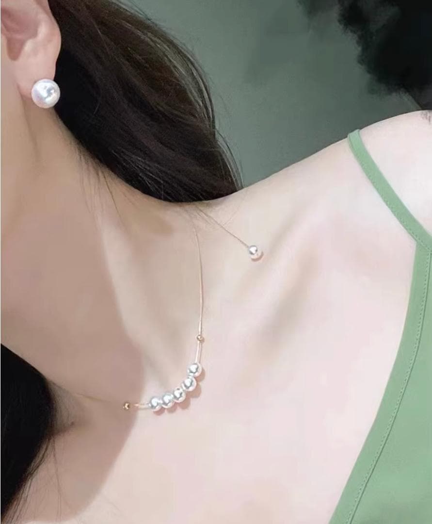 K18YG yellow gold necklace with 6-7mm Akoya pearls and Y-shaped 2Way Chopin chain on white background