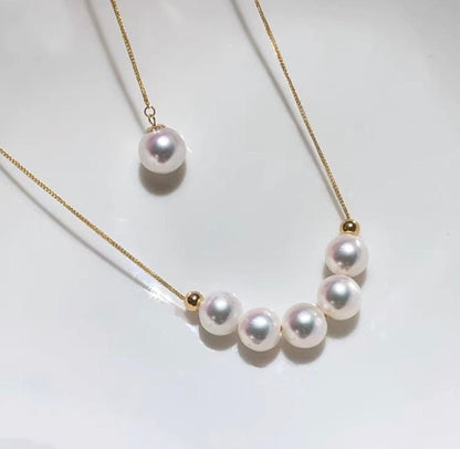 K18YG yellow gold necklace with 6-7mm Akoya pearls and Y-shaped 2Way Chopin chain on white background