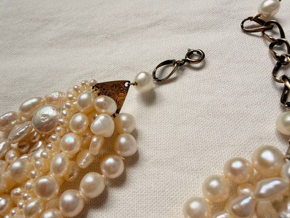 Kuro Multiple Freshwater Pearl Necklace with white freshwater pearls of different sizes on display