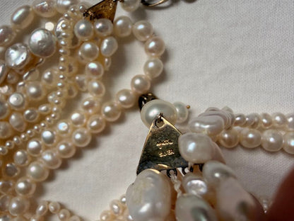 Kuro Multiple Freshwater Pearl Necklace with white freshwater pearls of different sizes on display