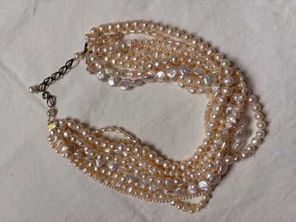 Kuro Multiple Freshwater Pearl Necklace with white freshwater pearls of different sizes on display
