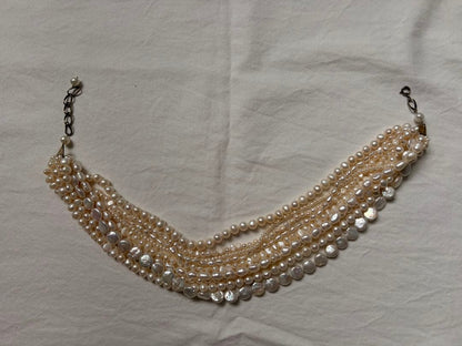 Kuro Multiple Freshwater Pearl Necklace with white freshwater pearls of different sizes on display