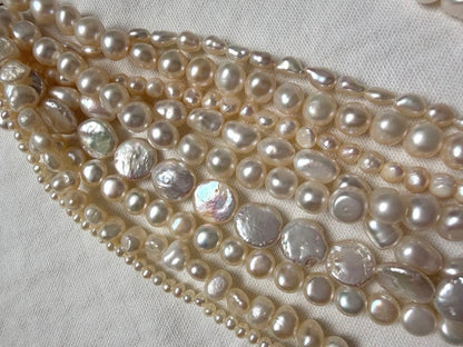 Kuro Multiple Freshwater Pearl Necklace with white freshwater pearls of different sizes on display