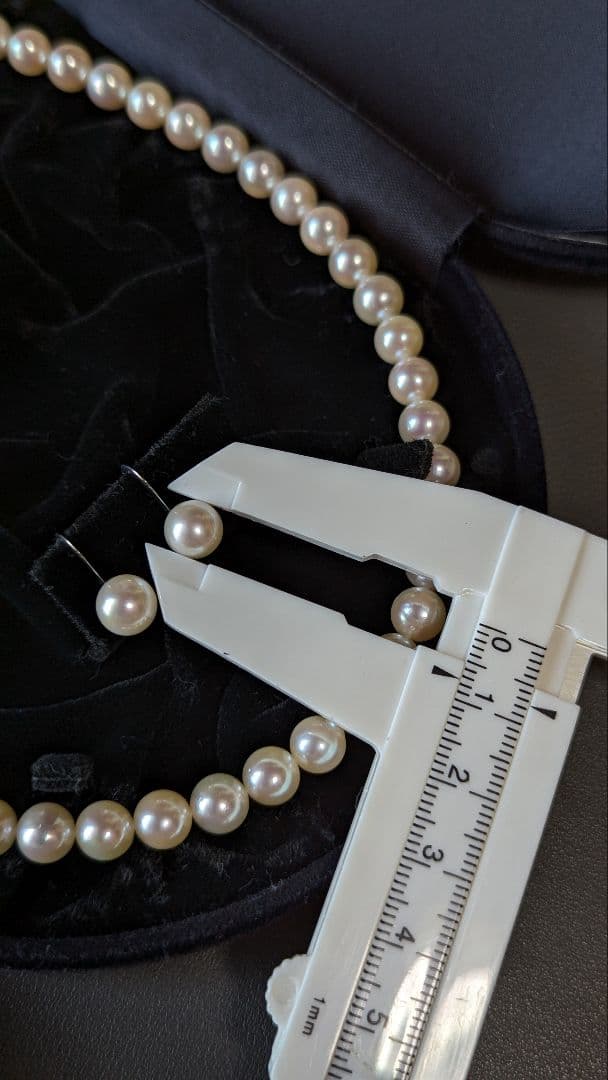 Akoya pearl necklace, platinum ring size 11, and matching earrings set with silver clasp