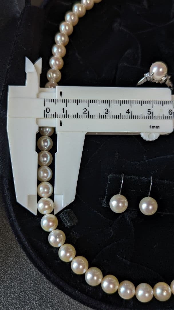 Akoya pearl necklace, platinum ring size 11, and matching earrings set with silver clasp