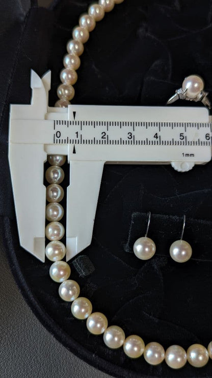 Akoya pearl necklace, platinum ring size 11, and matching earrings set with silver clasp