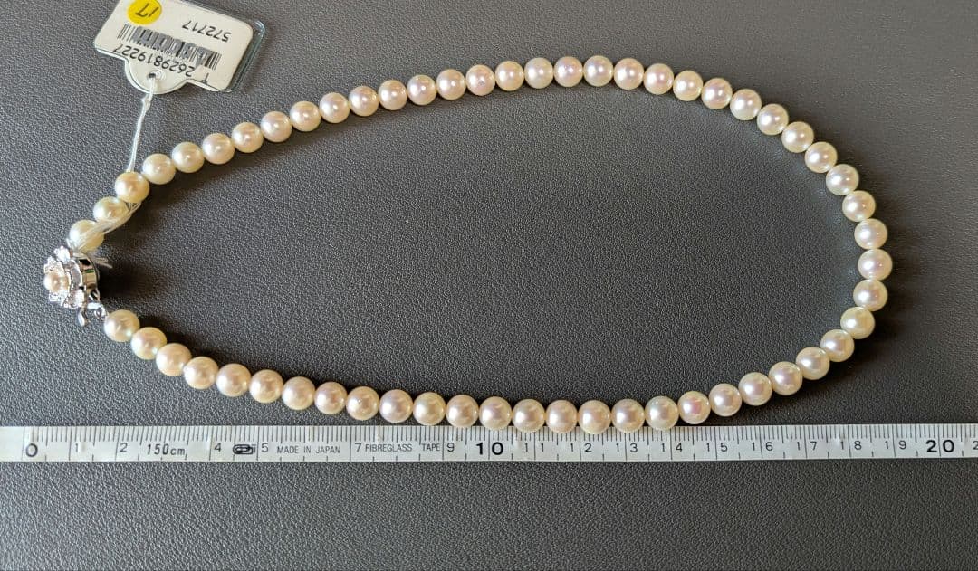 Akoya pearl necklace, platinum ring size 11, and matching earrings set with silver clasp