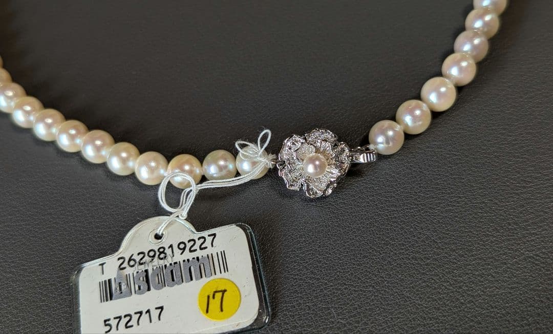 Akoya pearl necklace, platinum ring size 11, and matching earrings set with silver clasp