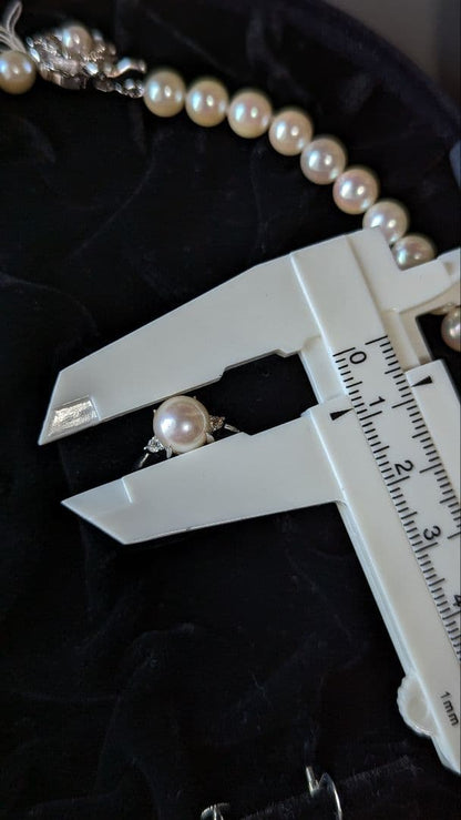 Akoya pearl necklace, platinum ring size 11, and matching earrings set with silver clasp