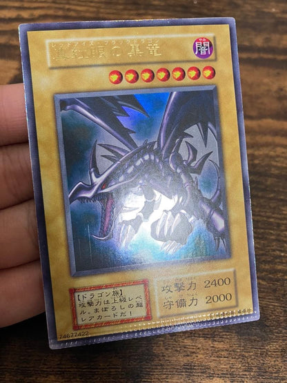 Yugioh Red Eyes Black Dragon Ultra Rare card with pack tear error at bottom from Japan import