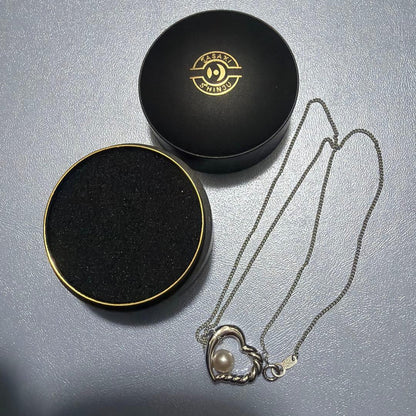 Tasaki SV925 Open Heart Pearl Necklace with 1.9 cm pendant on 41 cm chain, silver heart-shaped design with pearl