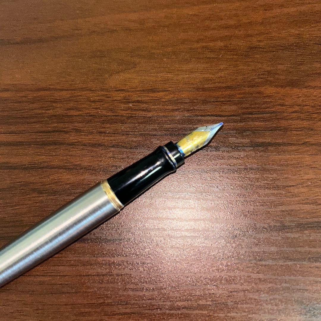 Vintage Waterman fountain pen with case showing minor scratches and dirt on the pen body