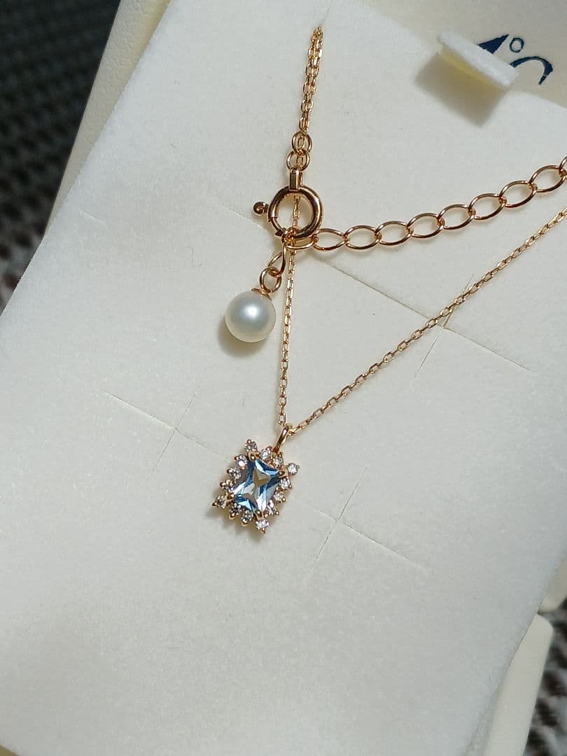 Moon Label necklace in 10K yellow gold featuring aquamarine, 0.07ct diamond, and 4mm Akoya pearl on a 43cm chain
