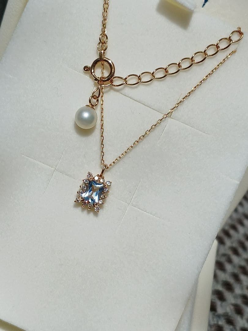 Moon Label necklace in 10K yellow gold featuring aquamarine, 0.07ct diamond, and 4mm Akoya pearl on a 43cm chain