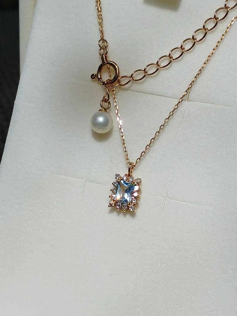 Moon Label necklace in 10K yellow gold featuring aquamarine, 0.07ct diamond, and 4mm Akoya pearl on a 43cm chain