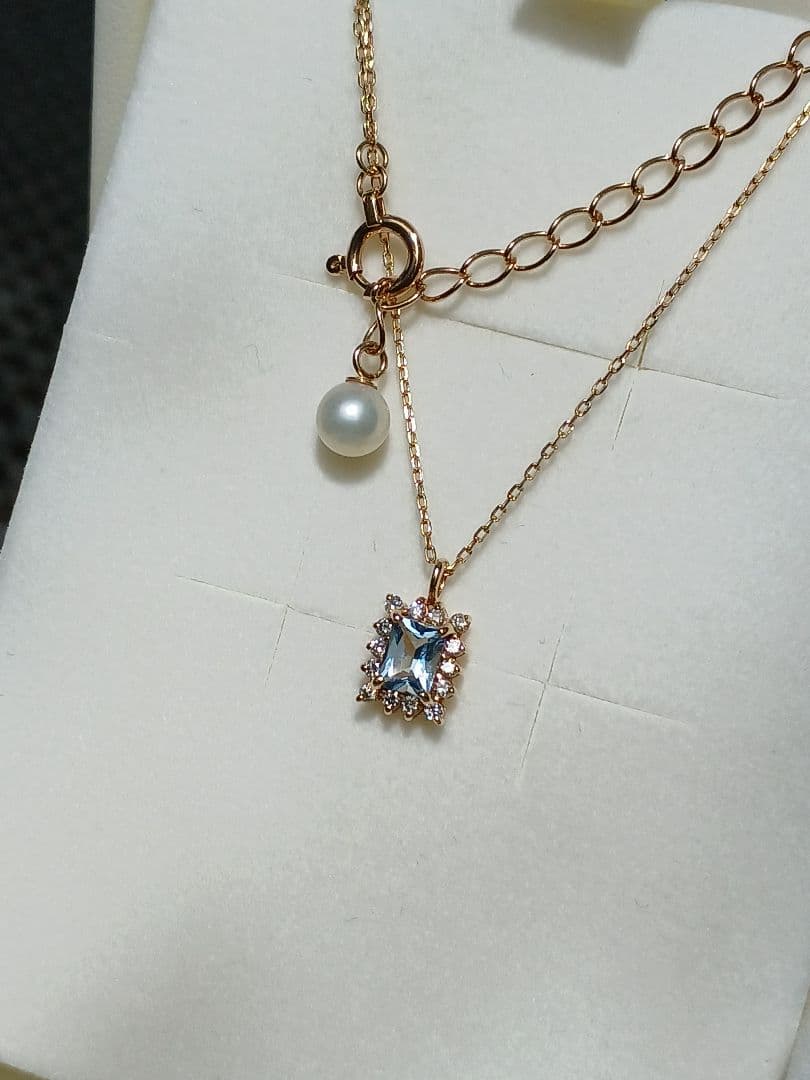 Moon Label necklace in 10K yellow gold featuring aquamarine, 0.07ct diamond, and 4mm Akoya pearl on a 43cm chain