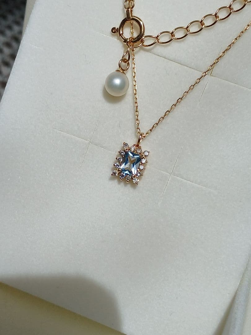 Moon Label necklace in 10K yellow gold featuring aquamarine, 0.07ct diamond, and 4mm Akoya pearl on a 43cm chain