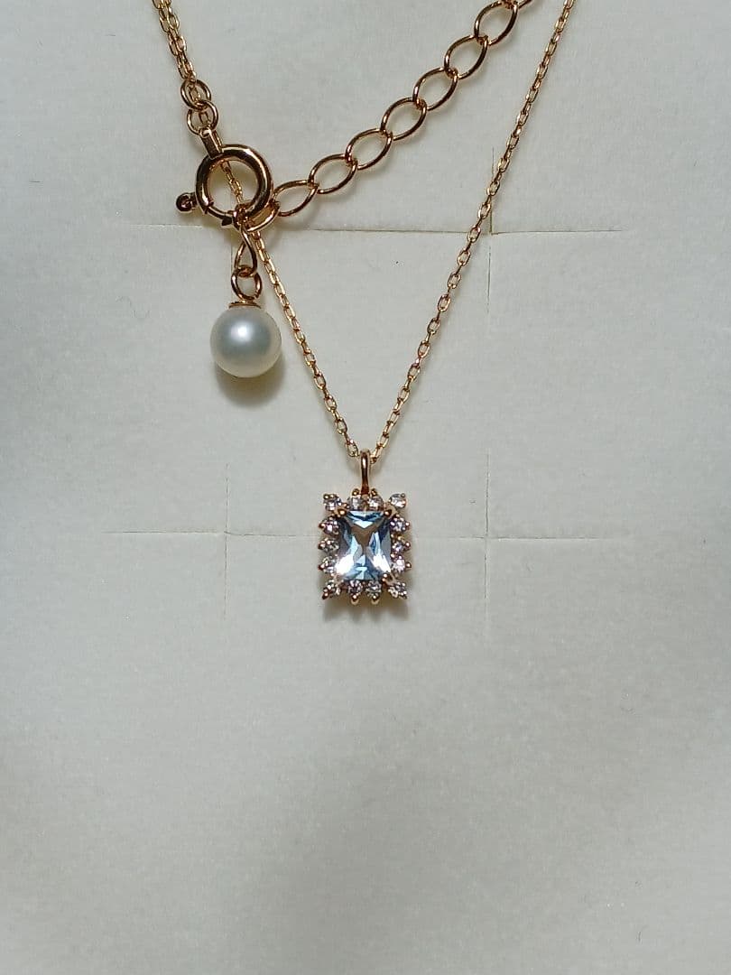 Moon Label necklace in 10K yellow gold featuring aquamarine, 0.07ct diamond, and 4mm Akoya pearl on a 43cm chain