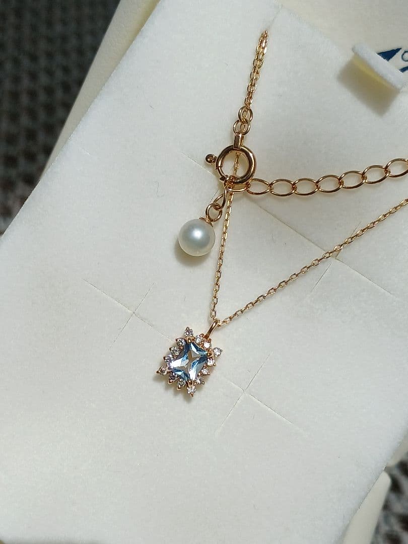 Moon Label necklace in 10K yellow gold featuring aquamarine, 0.07ct diamond, and 4mm Akoya pearl on a 43cm chain